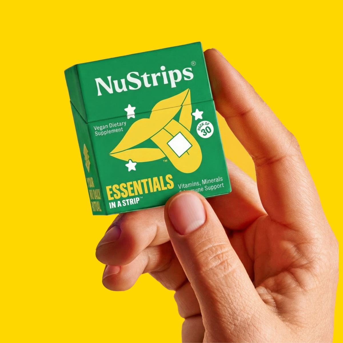 Hand holding a NuStrips Essentials box