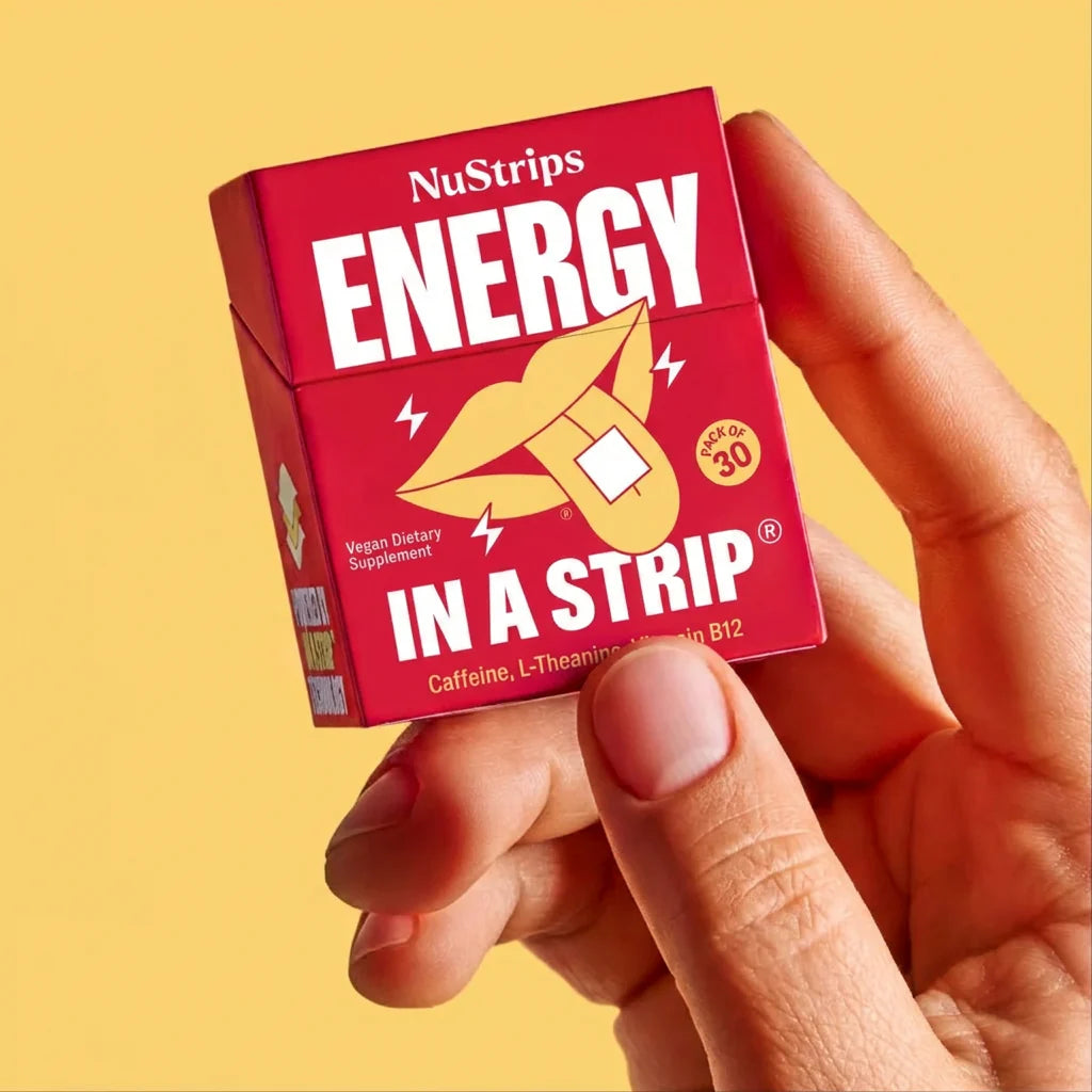 A hand holding a NuStrips Energy box in front of a phone showing verified customer reviews